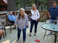 Enjoying a game of cornhole on the deck of our cabin.
